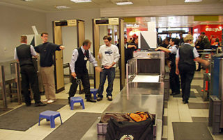 airport security checking passengers