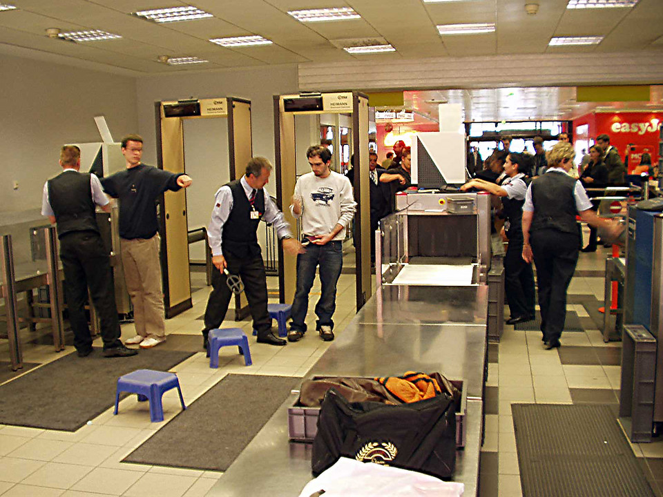 airport security checking passengers